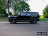 Side view of Rivian R2 with gloss black AW10 20x8.5 forged wheels and Michelin X-ICE SNOW 255/60 tires