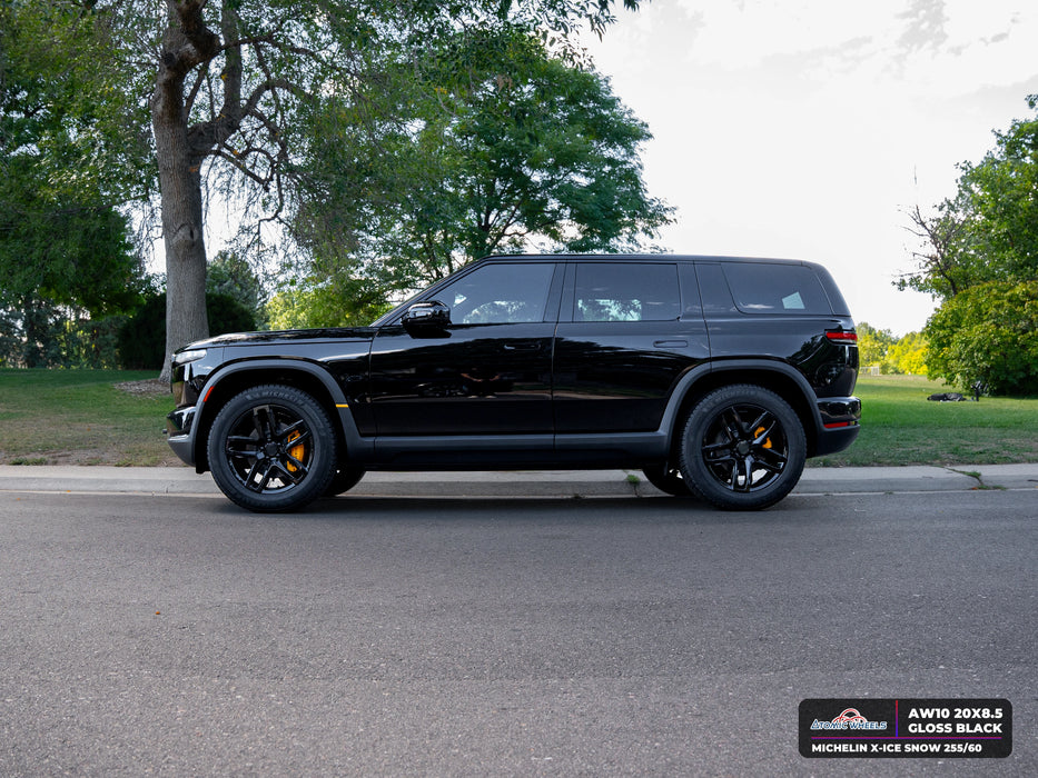 Side view of Rivian R2 with gloss black AW10 20x8.5 forged wheels and Michelin X-ICE SNOW 255/60 tires