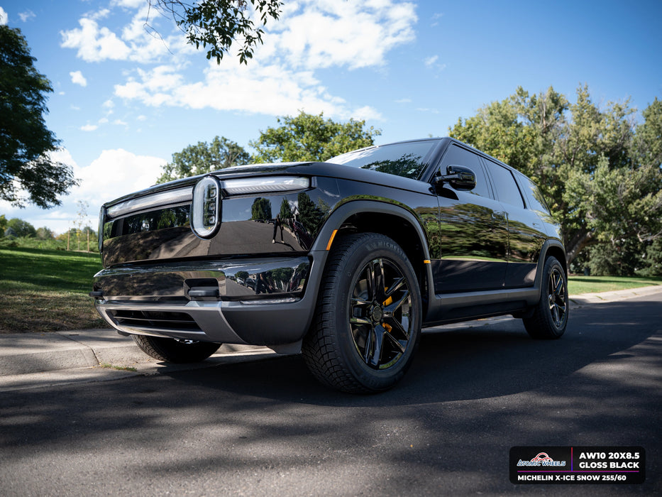Front three-quarter view of Rivian R2 with gloss black AW10 20x8.5 forged wheels and Michelin X-ICE SNOW 255/60 tires