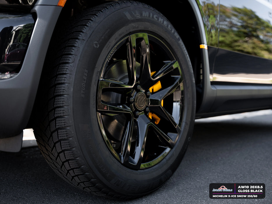 Wheel and tire detail of Rivian R2 with gloss black AW10 20x8.5 forged wheels and Michelin X-ICE SNOW 255/60 tires