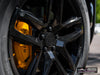 Center-cap and wheel detail of Rivian R2 with gloss black AW10 20x8.5 forged wheels and Michelin X-ICE SNOW 255/60 tires