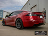 Rear three-quarter view with obscured license plate of red Tesla Model S Long Range with titan AWZZ forged wheels, 19x9.5 front and 19x10.5 rear, and Michelin Pilot Sport All Season 4 tires