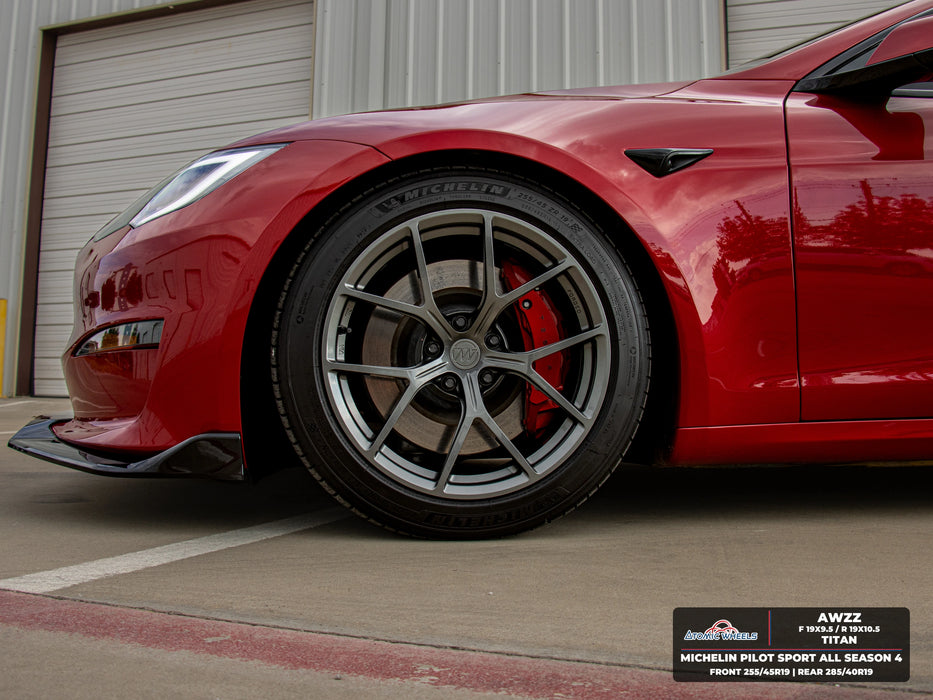 Front wheel close-up of red Tesla Model S Long Range with titan AWZZ forged wheels, 19x9.5 front and 19x10.5 rear, and Michelin Pilot Sport All Season 4 tires