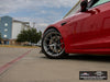 Front wheel and side body view of red Tesla Model S Long Range with titan AWZZ forged wheels, 19x9.5 front and 19x10.5 rear, and Michelin Pilot Sport All Season 4 tires