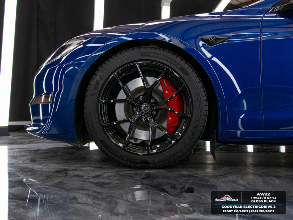 Front wheel and body detail of blue Tesla Model S Plaid with gloss black AWZZ forged wheels, 19x9.5 front and 19x10.5 rear, and Goodyear ElectricDrive 2 tires